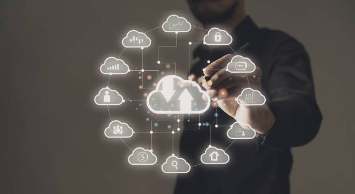 Hybrid cloud Dubai 2026 IT team reviewing cloud migration plan on multiple monitors in Abu Dhabi enterprise office