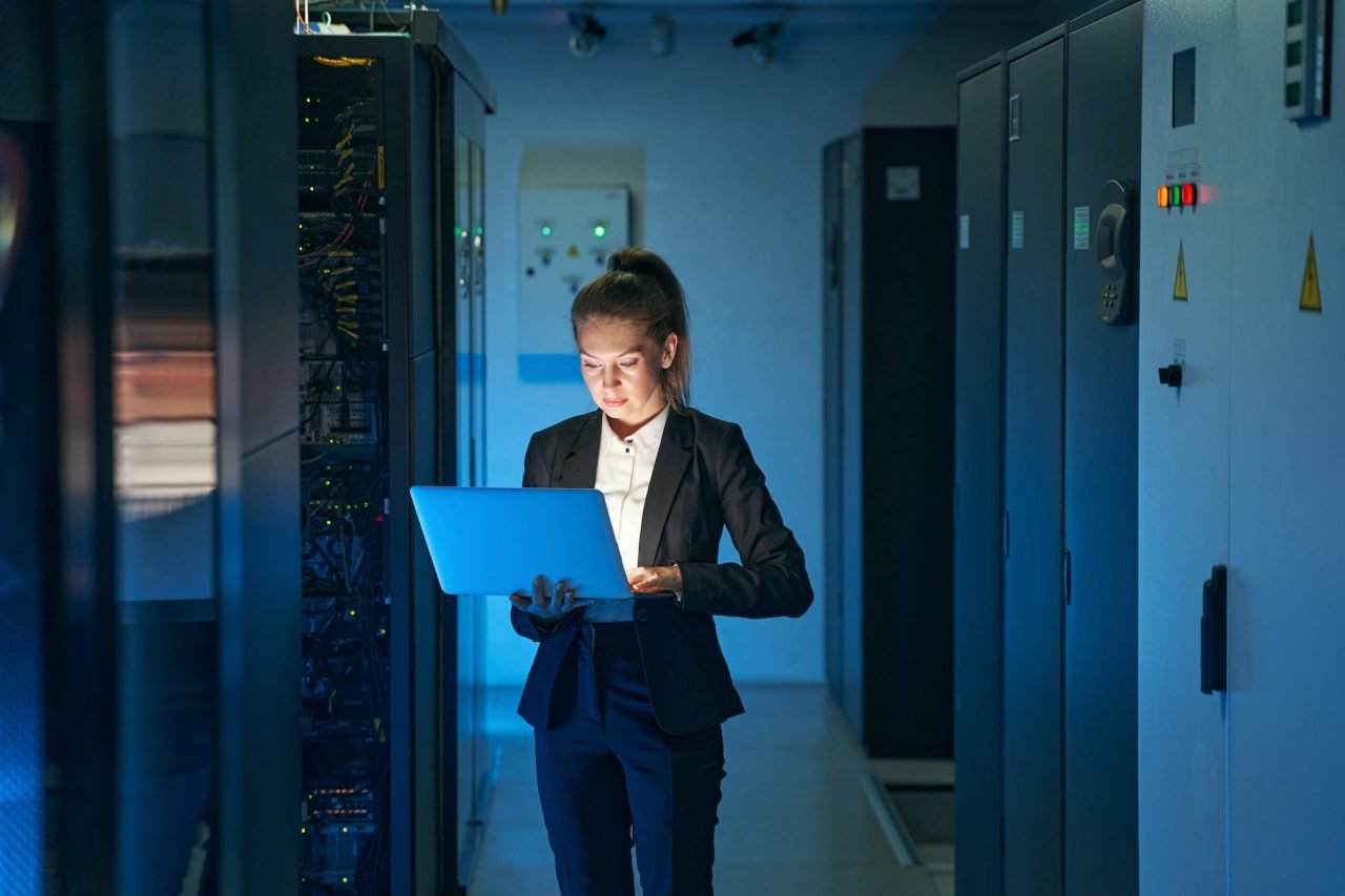 IT engineer working on systems in a modern UAE network operations centre - Microsoft Partner UAE